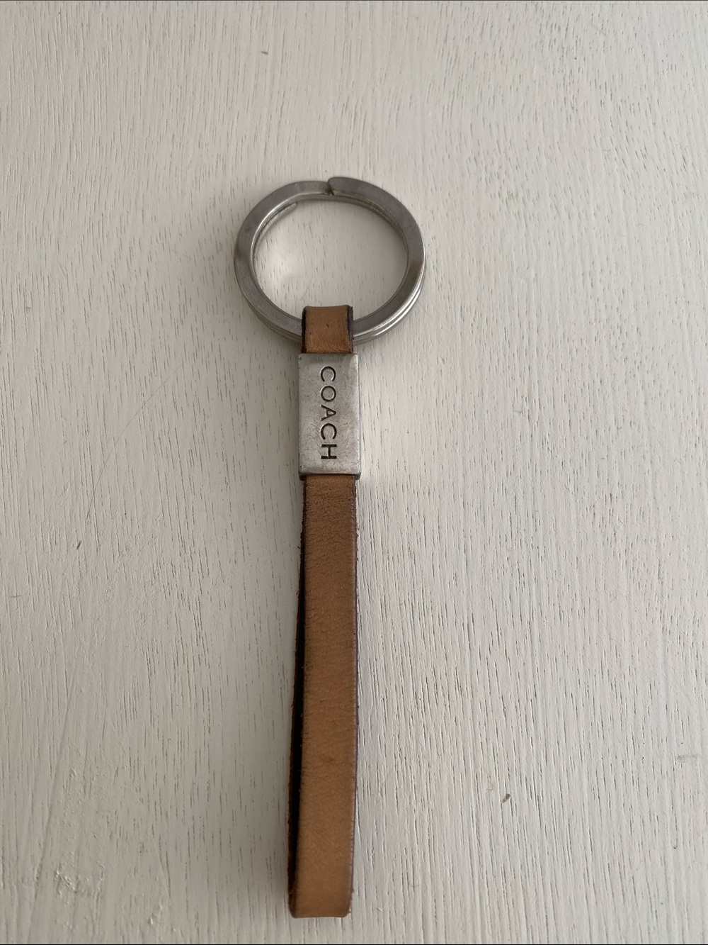 Coach leather strap keychain beige